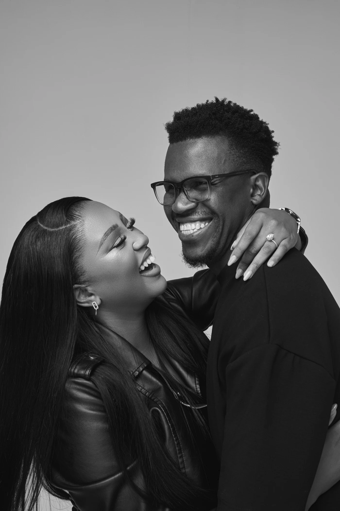 Phinius and Victoria Sebatsane smiling together, with Victoria’s arm around his shoulder.