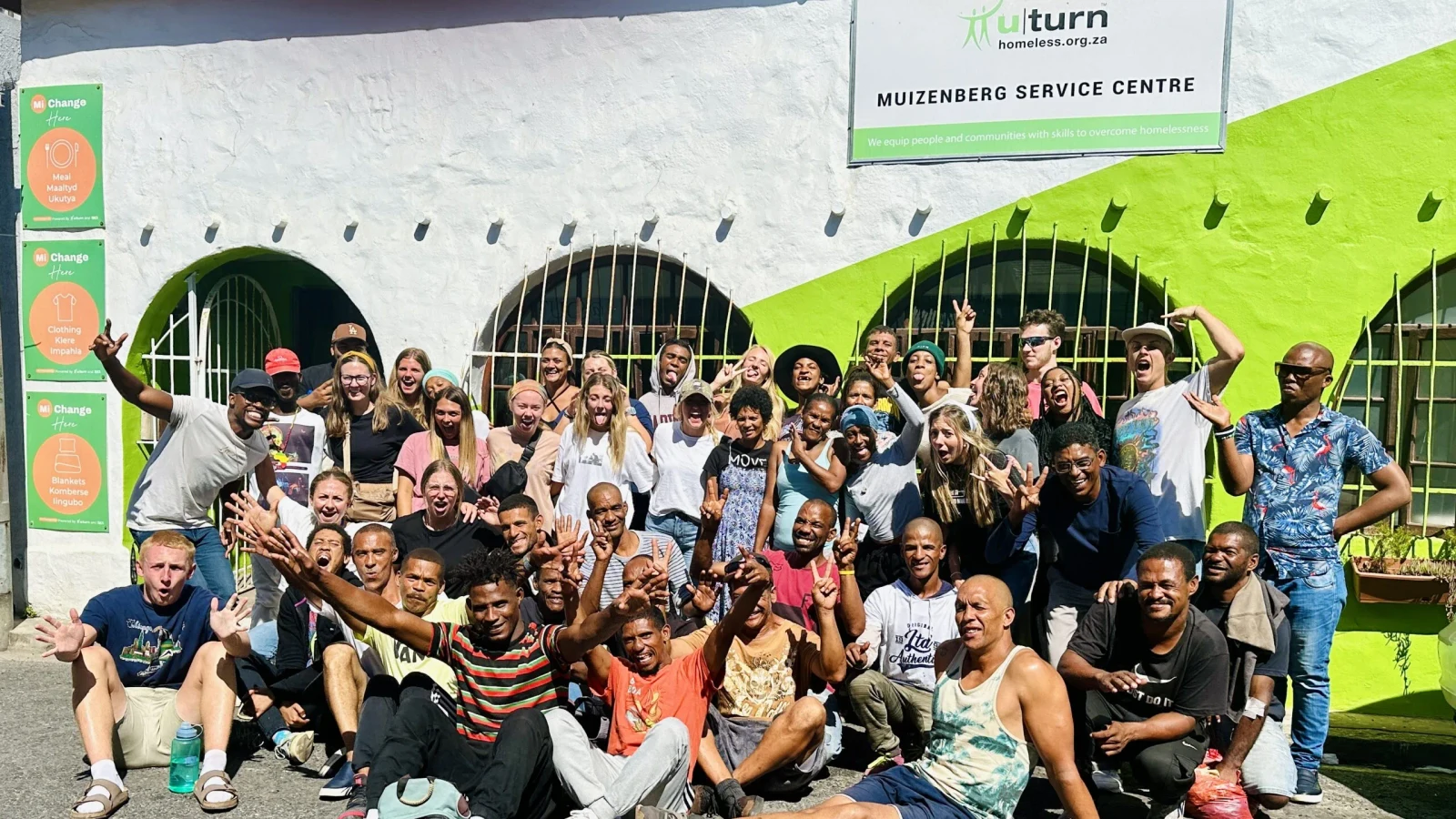 A community gathering outside the U-turn Muizenberg Service Centre.